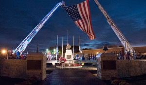 FF Memorial ladder trucks with flag by Bill Green for the NFFF