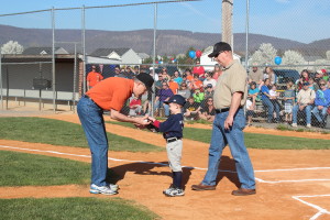 Dr. Love, Greg Eyler and his grandson after opening pitch